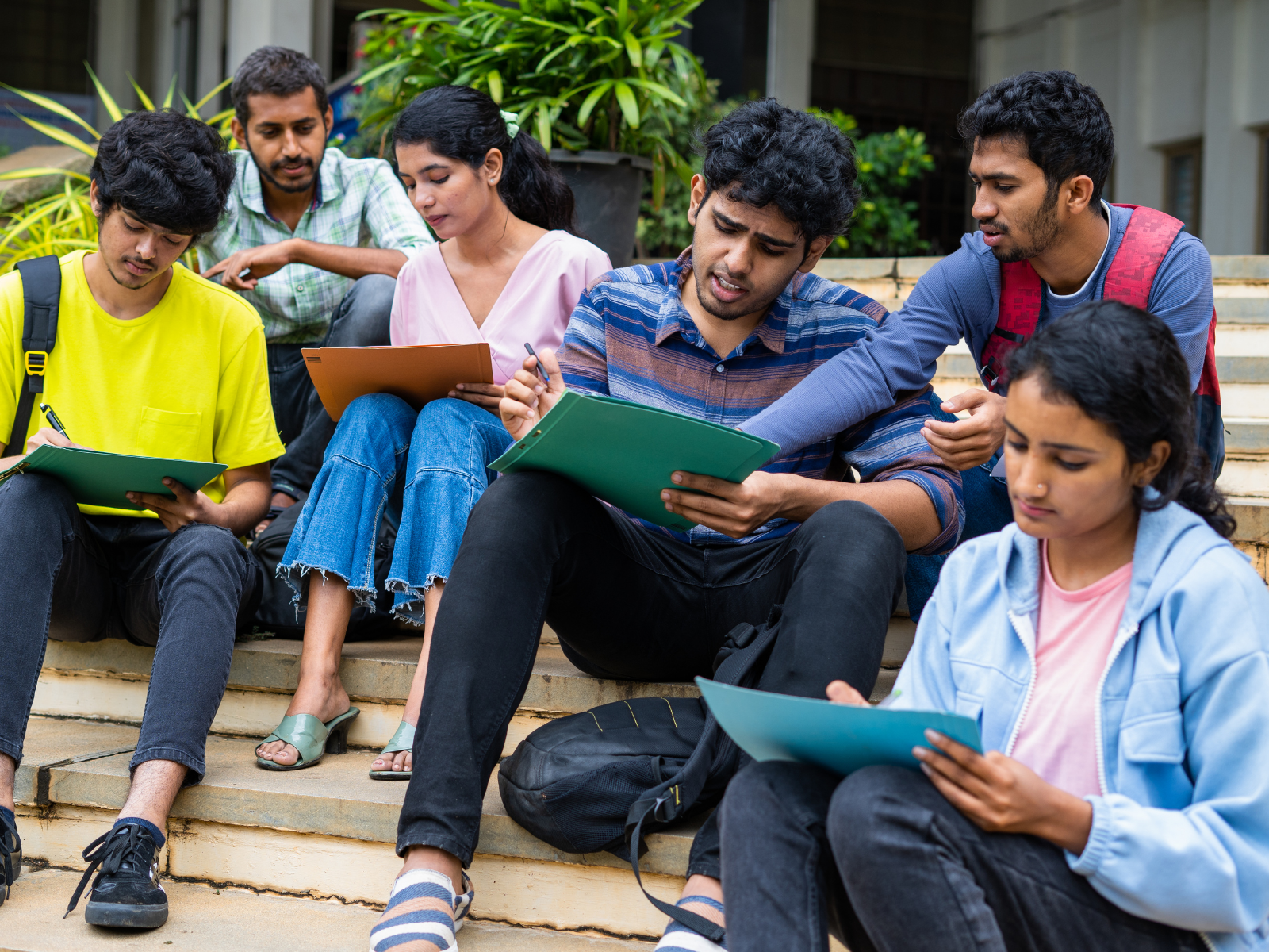 Diverse university students collaborating with laptops—global learning and future careers